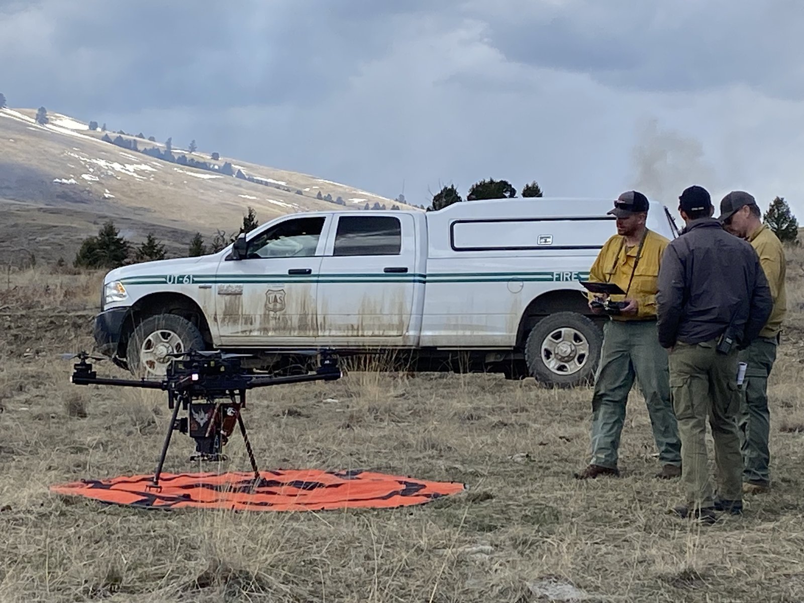 A U.S. Forest Service crew with a drone at a prescribed burn